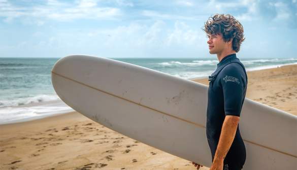 Someone holding a surfboard