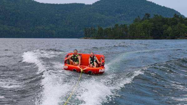 Two Adults Tubing on the Lake