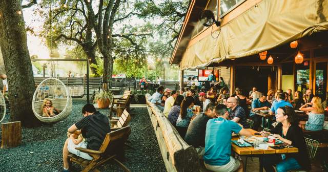 people dining on the patio at Loro in austin texas