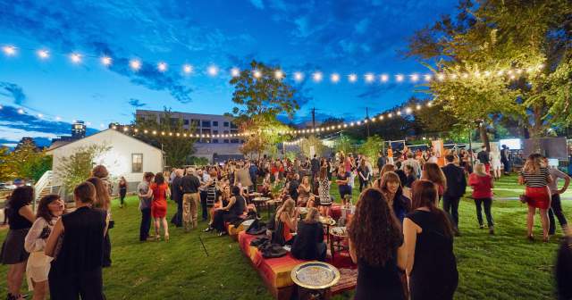 twilight at fair market outdoor event venue with people and twinkle lights in austin texas