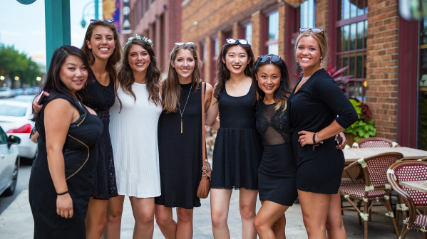 bachelorette party smiling for group photo outside Third Ward