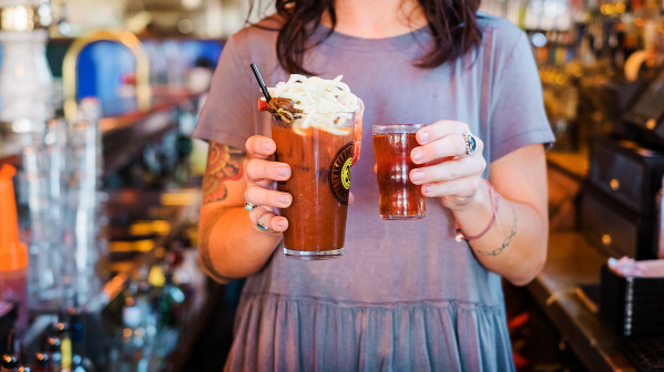 bartender holding bloody mary