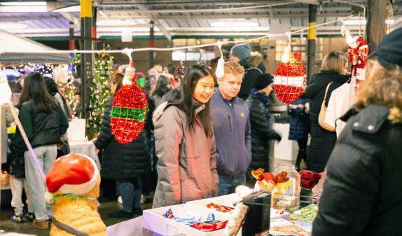 Couple shopping at Kindlefest holiday market