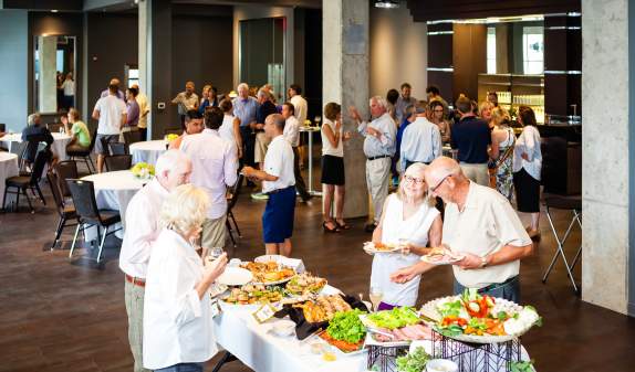 Group enjoying a reception at Zingerman's Greyline