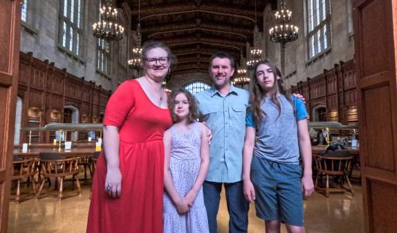 St. Clair family standing in Law library