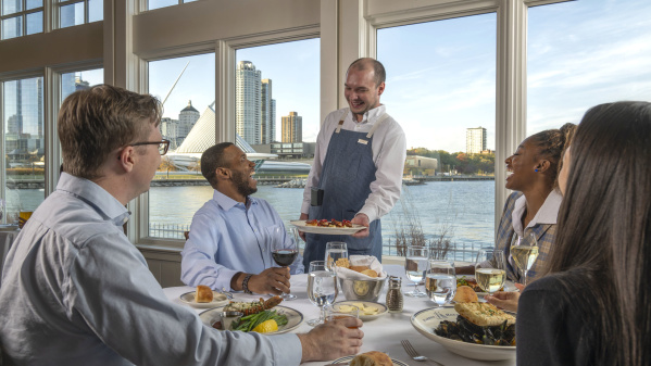 Interior-Server delivering Food to Window Table