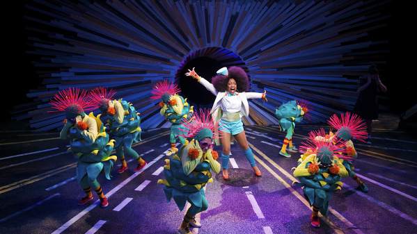 performers on stage looking energetic in scene