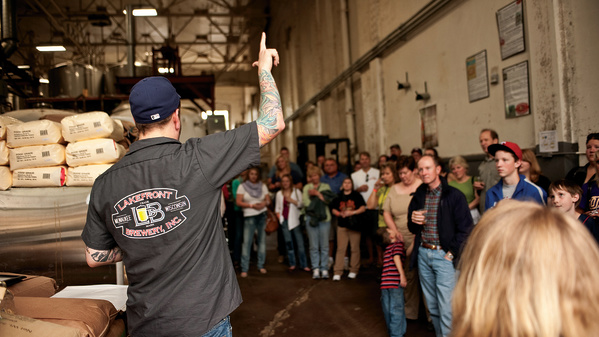 tour guide talking while crowd listens intently