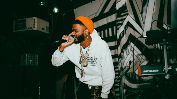 performer singing with mic in hand