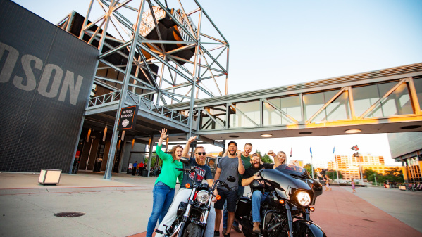Friends on/around motorcycles at Harley Davidson