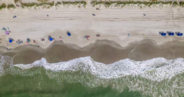 An aerial view of waves and the beach in North Myrtle Beach