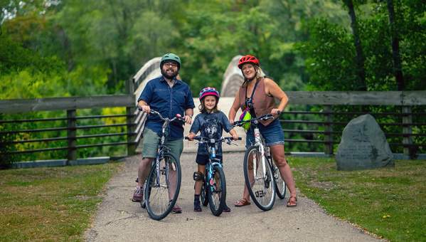 Family biking on Border to Border Trail