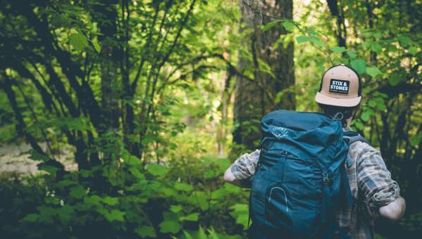 man hiking in the woods