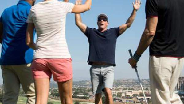 A group of golfers celebrates during play