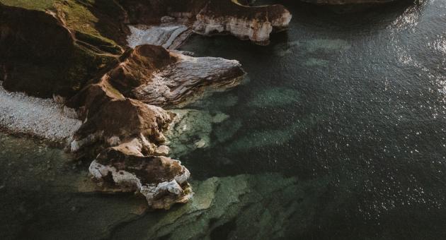 The cliff edge of Flamborough Head with clear seas.