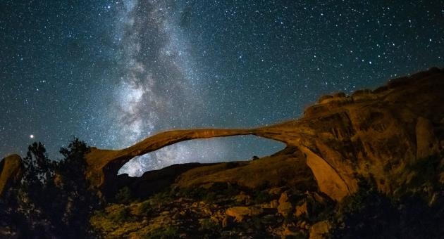 Landscape Arch at night: the Milky Way is pictured above it.