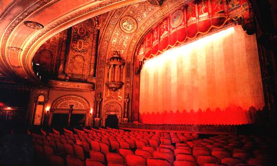 Red Tinted Photo of Historic Landmark Theater Stage and Seating