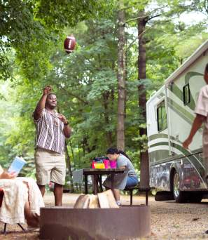 Father and son throwing a football at Lake George RV Park
