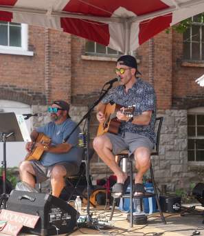 Two guitarists playing at Thursday Market & Food Truck Corral