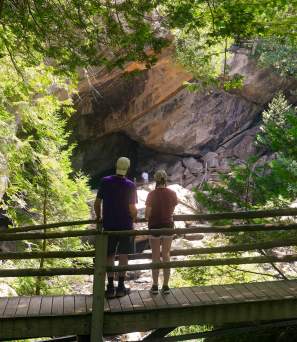 Couple standing on a bridge at Natural Stone Bridge and Caves