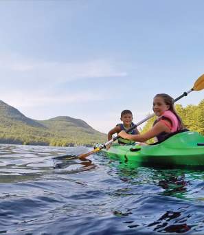 Two Kids Kayaking on the Lake