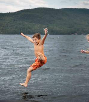 Two Kids Swimming in the Lake