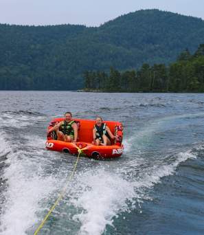 Two Adults Tubing on the Lake