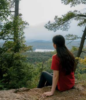 Hiker sitting on a summit