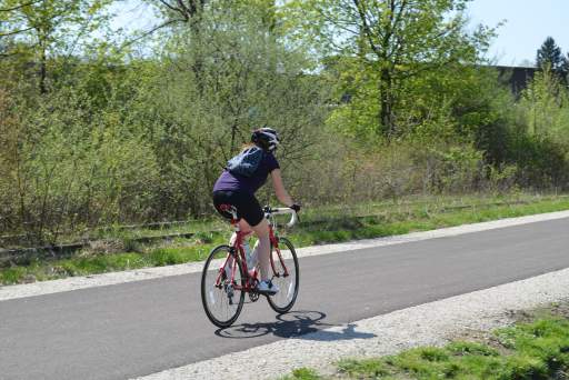 Woman riding a bike on a bike path in Akron, Ohio