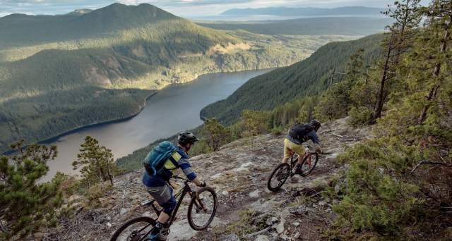 Mountain bikers ride a trail on Mt. Mahony that overlooks Haslam Lake.