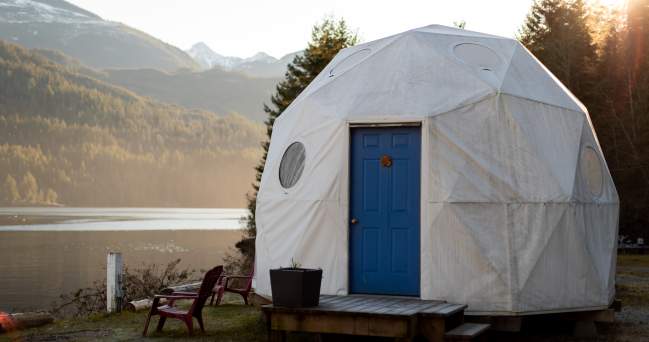 An exterier view of a geodesic glamping dome.