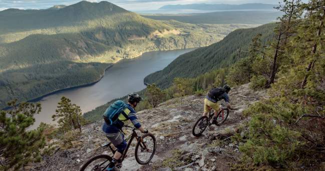 Mountain bikers ride a trail on Mt. Mahony that overlooks Haslam Lake.