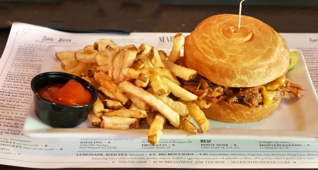 Delicious sandwich with French fries