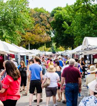 people checking out vendors at Fourth Street Festival during Labor Day in Bloomington