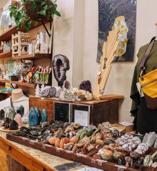 A display of clothing, gemstones, art, and more at Gather