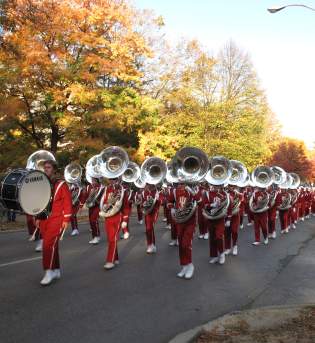 Marching band in uniform and playing their instruments at the IU Homecoming Parade