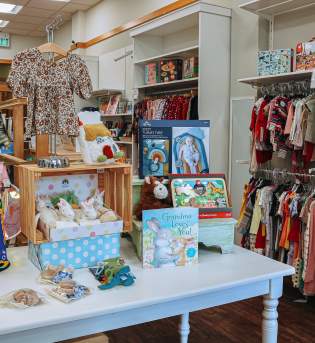 Displays of children's items for sale at O'Child Children's Boutique