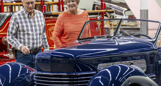 Cover of the 2026 Manhattan Visitor Guide at the Midwest Dream Car Collection.