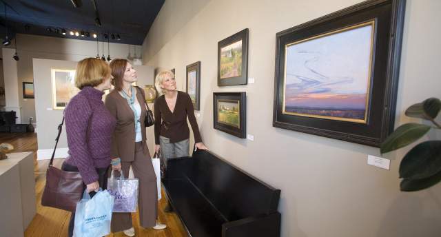 Ladies browsing art gallery