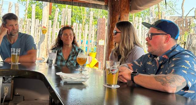 Friends drinking a beer at Sconni's