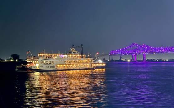 Creole Queen and the Crescent City Connection at Night from the Algiers Ferry