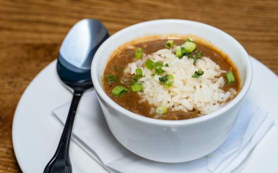 A cup of Chicken and Andouille gumbo with rice