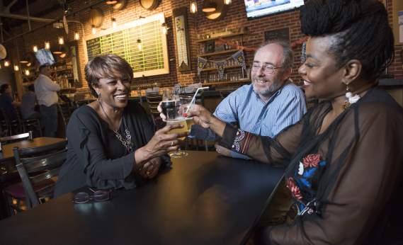 People Toasting at Collusion Tap Works