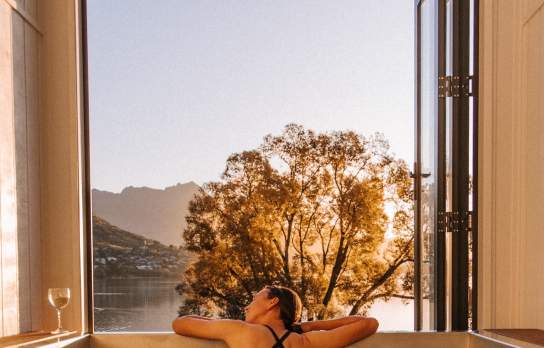 A lady enjoying the evening sunshine in a Driftaway Holiday Park Hot Tub