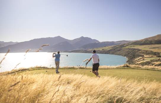 Friends golfing at Jacks Point Course in Summer