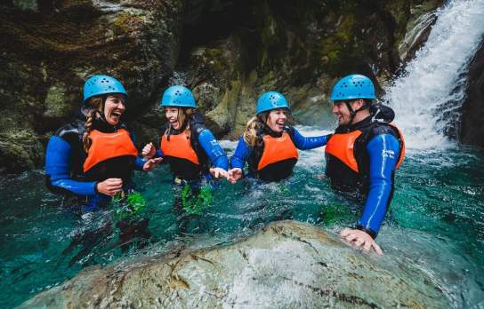 Group of four people in the routeburn canyon