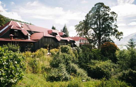 Sherwood Hotel and Restaurant with lush green natives
