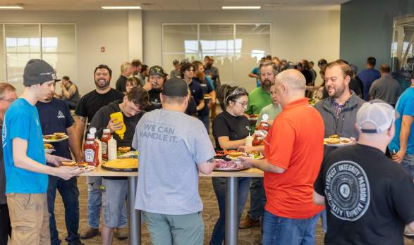 Vortex employees at event making burgers in Salina, Kansas