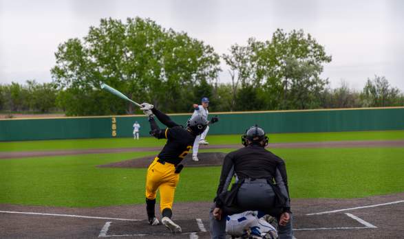 A batter swings at a pitch during a game.