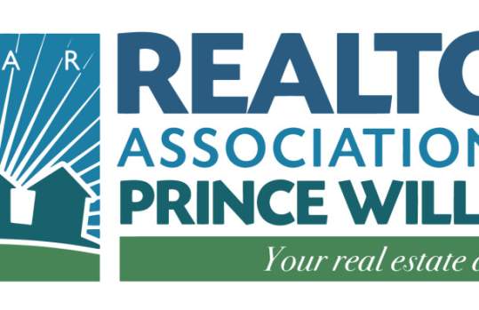 A white, blue and green logo. The logo has 3 houses on it and the words "PWAR Realtor Association of Prince William Your real estate advocate" written in text on the image.